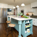 Brand new remodeled vintage farmhouse kitchen in Portland features cottage and retro cabinetry and light fixtures