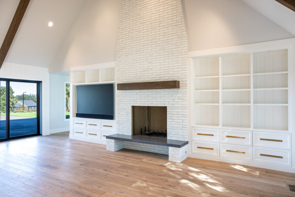 modern farmhouse white brick fireplace and white cabinets