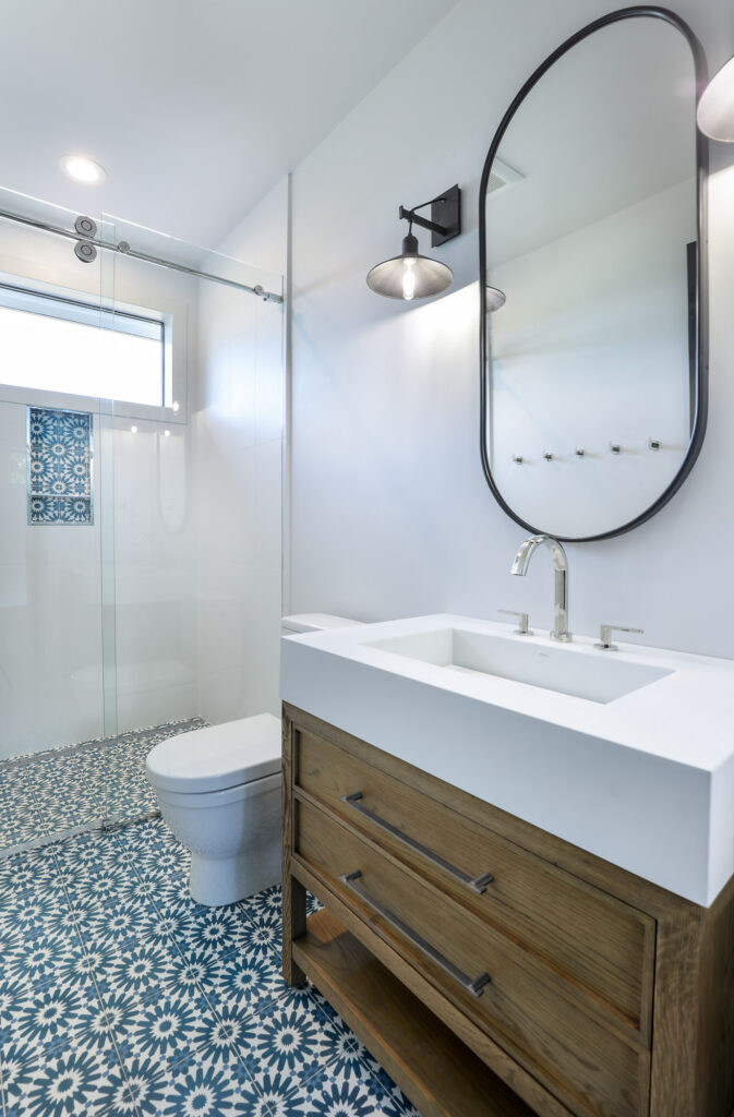 modern farmhouse guest bathroom with wood cabinet sink and industrial touches