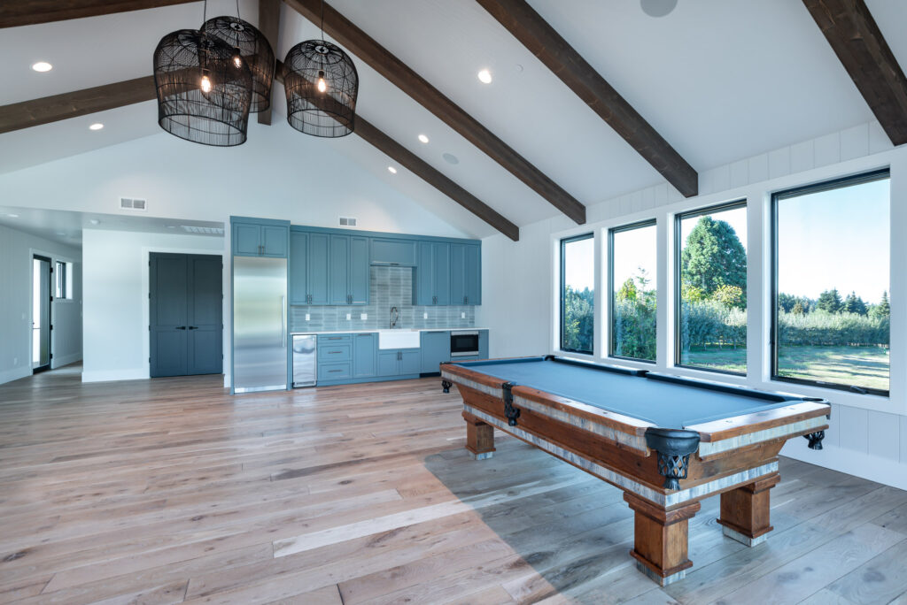 modern farmhouse guest house with pool table and built in kitchen