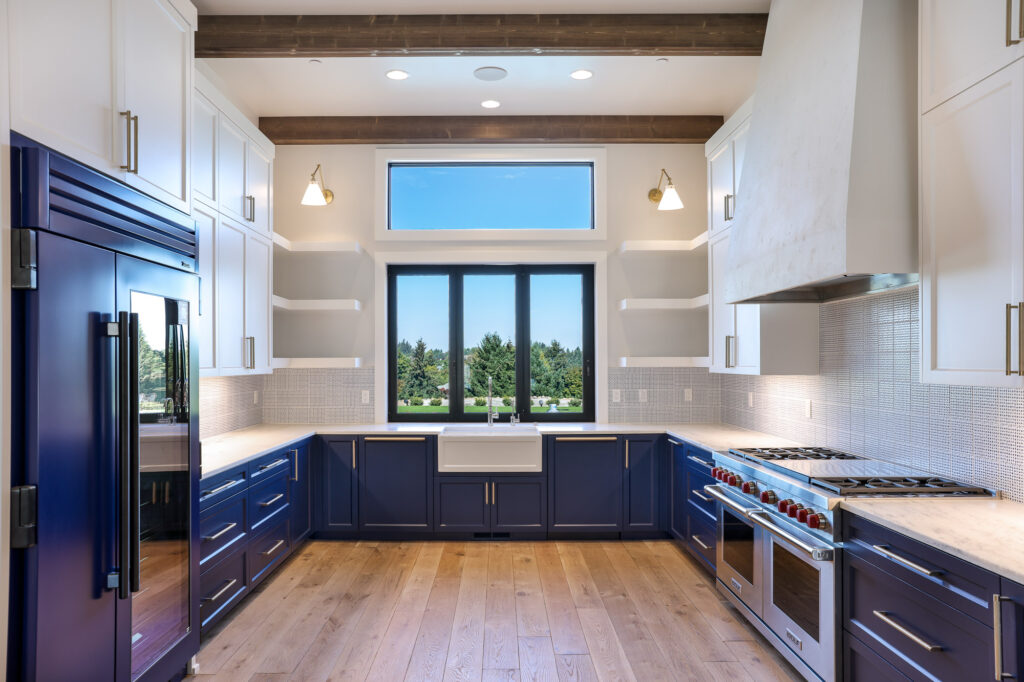 modern farmhouse kitchen with textured hood and dark cabinets