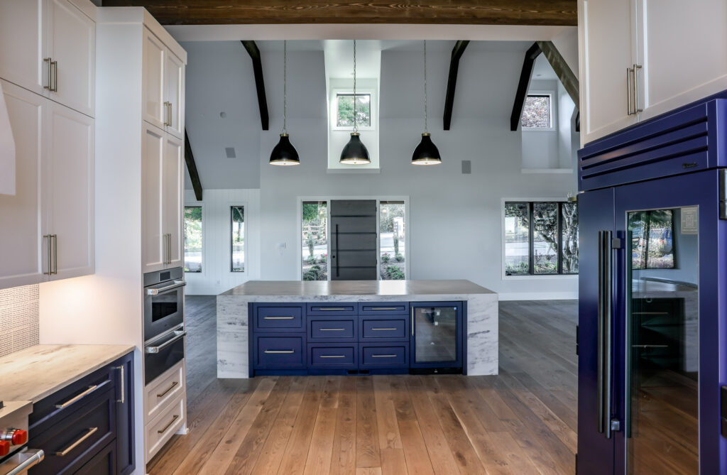 modern farmhouse kitchen island with dark blue cabinets