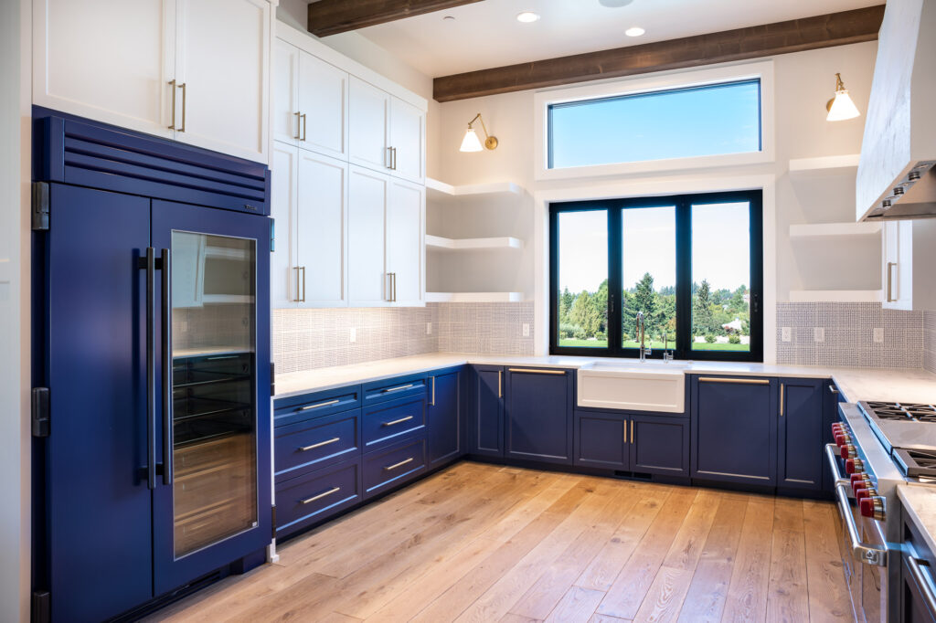 modern farmhouse kitchen with white upper cabinets and blue lower cabinets