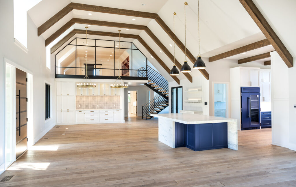 modern farmhouse family room and dining room with vaulted ceilings