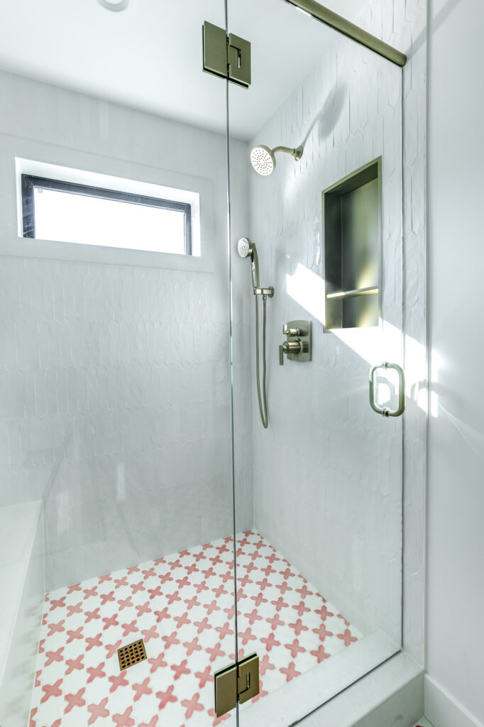 modern farmhouse girl's bathroom shower with pink tiles